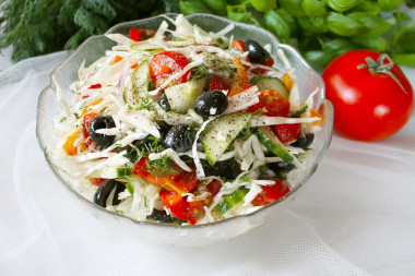 Salad with olives and tomatoes with young cabbage