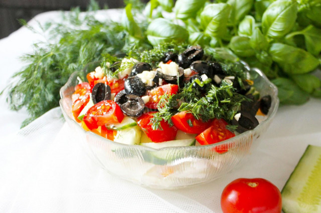 Salad with olives and tomatoes with young cabbage