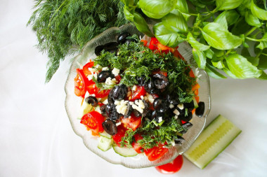 Salad with olives and tomatoes with young cabbage