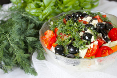 Salad with olives and tomatoes with young cabbage