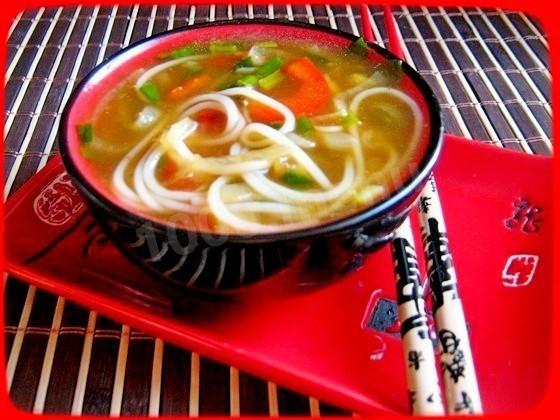 Onion soup with rice noodles and soy sauce