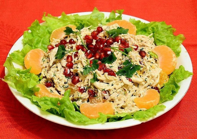 Salad with chicken fillet, matzoni, pomegranates and walnuts