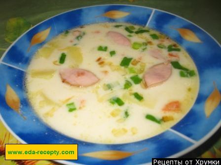 Sausage soup, potatoes and processed cheese