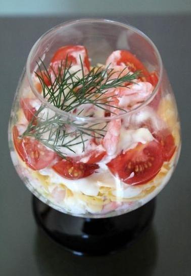 Portioned salad in cream cheese eggs shrimp tomatoes