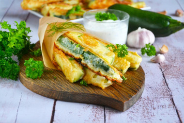 Fried zucchini in a pan with garlic