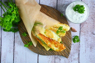 Fried zucchini in a pan with garlic