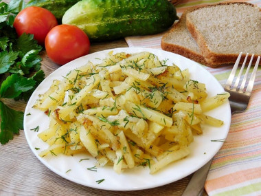 Fried potatoes with onions in a frying pan