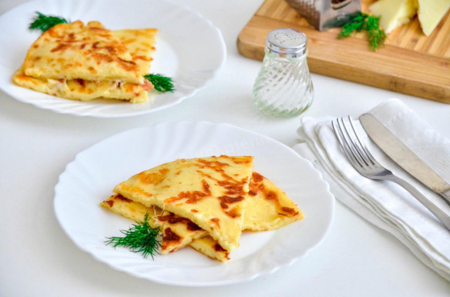 Lazy khachapuri with cheese on pan on kefir