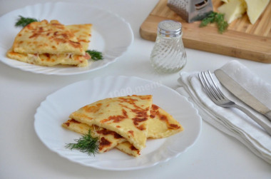 Lazy khachapuri with cheese on pan on kefir