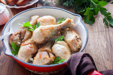 Chicken drumsticks in a frying pan