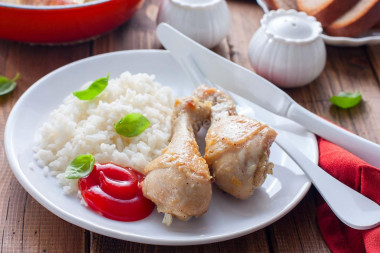 Chicken drumsticks in a frying pan