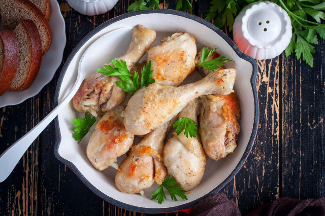 Chicken drumsticks in a frying pan