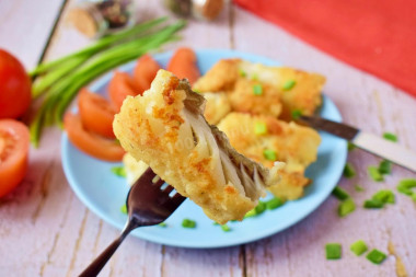 Fish in flour in a frying pan with a crust