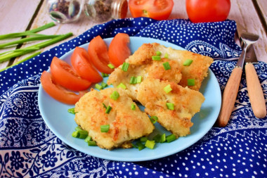 Fish in flour in a frying pan with a crust