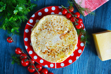 Khachapuri on kefir in a pan with cheese