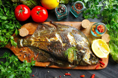 Whole flounder fried in a pan