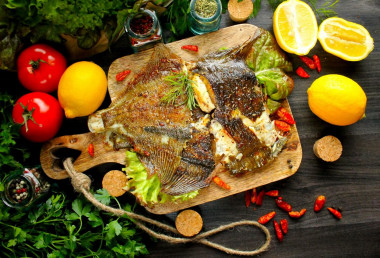 Whole flounder fried in a pan