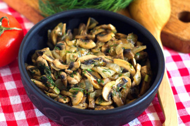 Fried mushrooms with onions in a frying pan