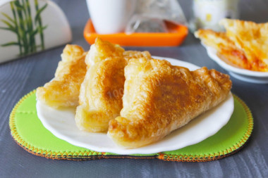 Puff pastry pies in a frying pan