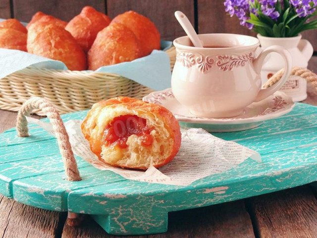 Fried pies with jam in a frying pan