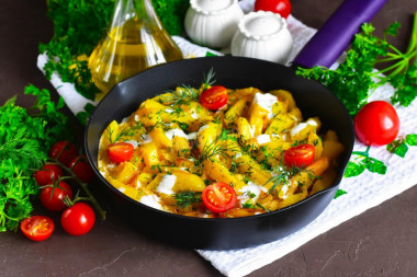 Fried potatoes in sour cream in a frying pan