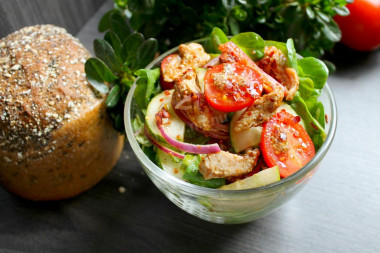 Salad with fried chicken breast and vegetables