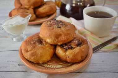 Fried white bread in a pan with meat