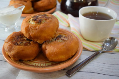 Fried white bread in a pan with meat