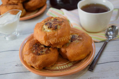 Fried white bread in a pan with meat