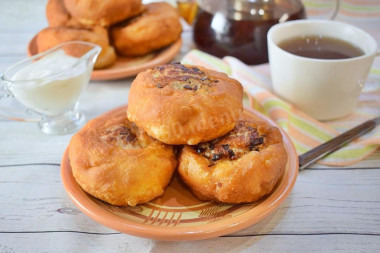 Fried white bread in a pan with meat