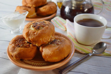 Fried white bread in a pan with meat