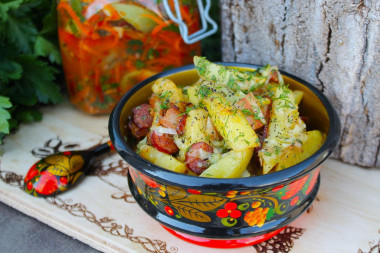 Fried potatoes with cabbage in a frying pan