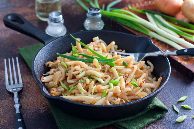 Squid fried in soy sauce with garlic in a pan