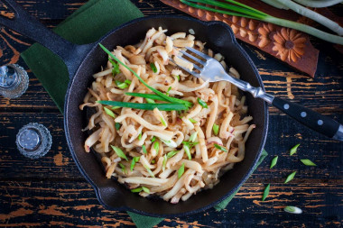 Squid fried in soy sauce with garlic in a pan