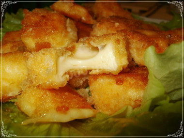 Soft fried cheese in breadcrumbs