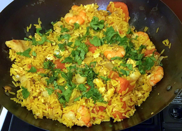 Fried rice with Thai seafood in a wok pan