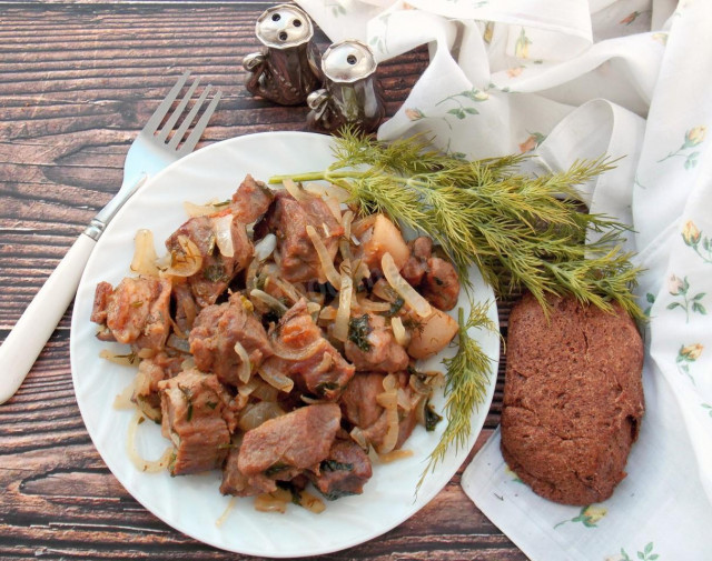 Pork fried in pieces in a frying pan