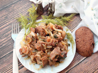 Pork fried in pieces in a frying pan