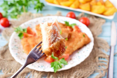 Fried pike perch in a frying pan