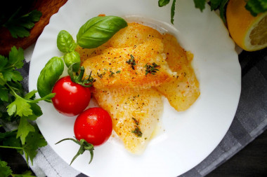 Halibut fillet fried in a frying pan