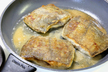 Fried flounder in pan