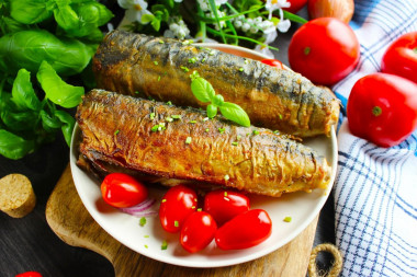 Fried mackerel in flour in a frying pan