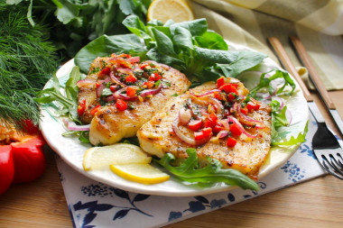 Pangasius on a grill pan with fried vegetables