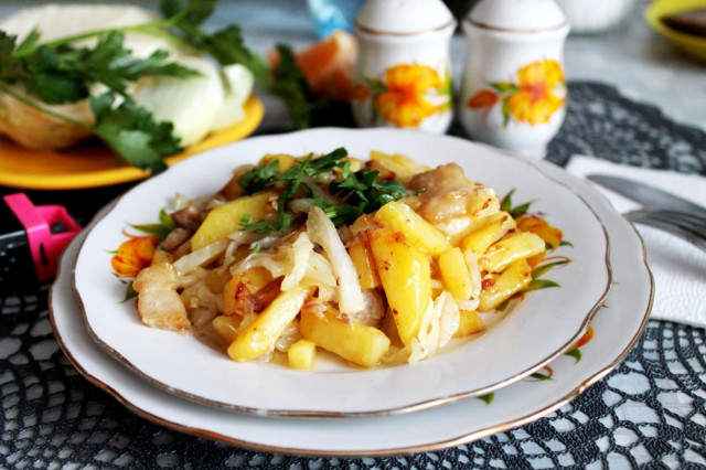 Fried potatoes with cabbage and onions