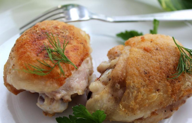 Flour fried chicken with pepper in a frying pan