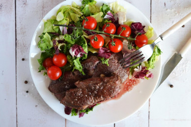 Rib eye steak in a frying pan