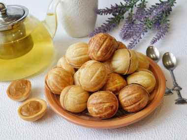 Nuts with boiled condensed milk in a hazelnut oven on gas