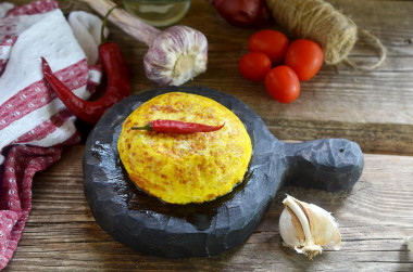 Fluffy omelet in a frying pan