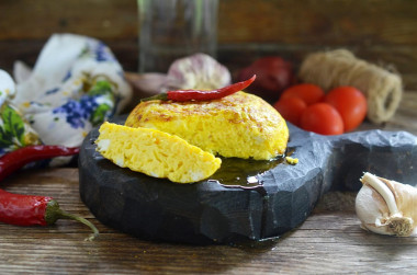 Fluffy omelet in a frying pan