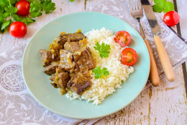 Liver with onions in a frying pan